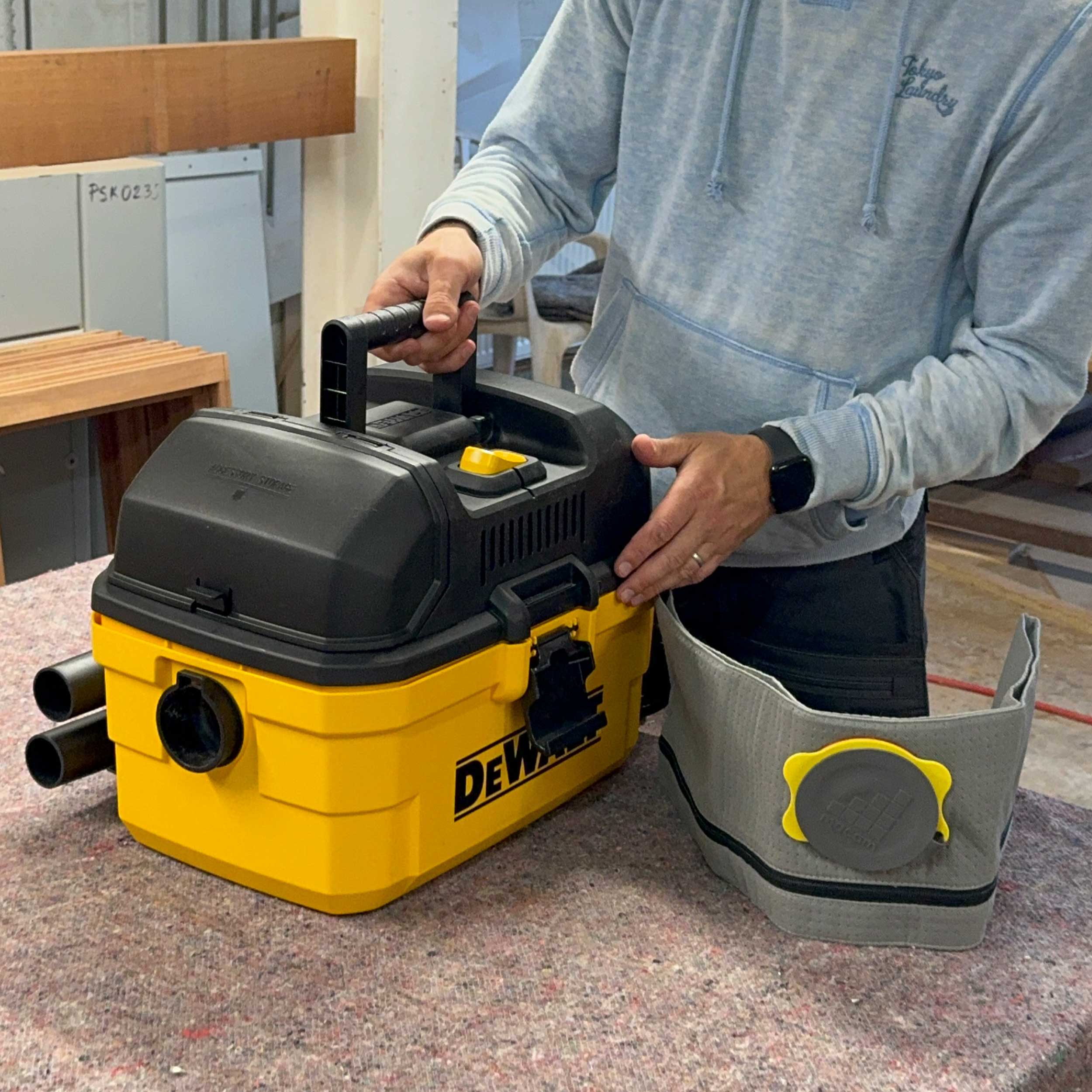 Reusable dust bag for DeWalt DXV04T/DXV15T shown with vacuum cleaner accessories